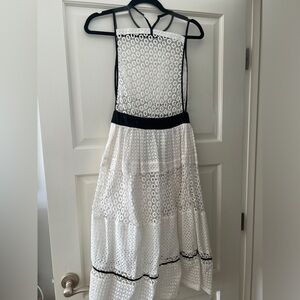 Kendall and Kylie white poplin dress w black trim.